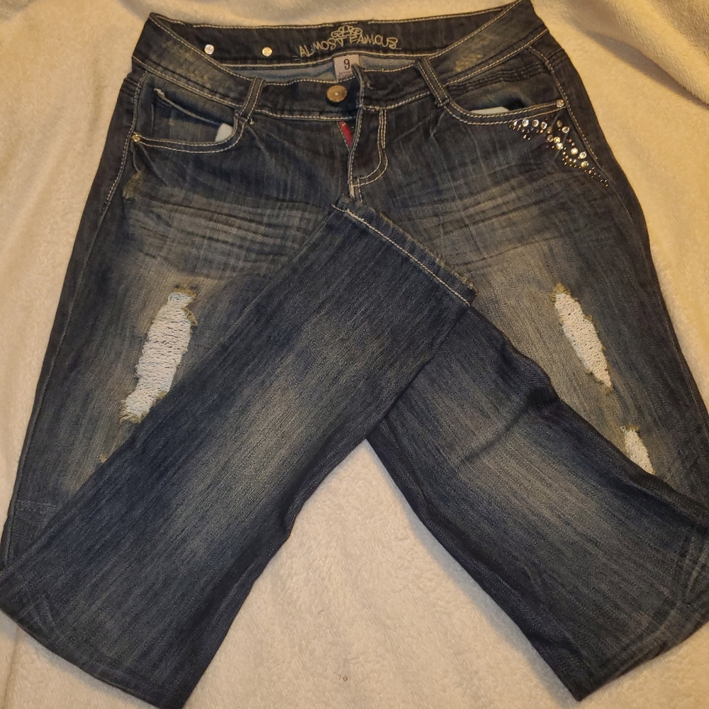 Studded, distressed stretch jeans